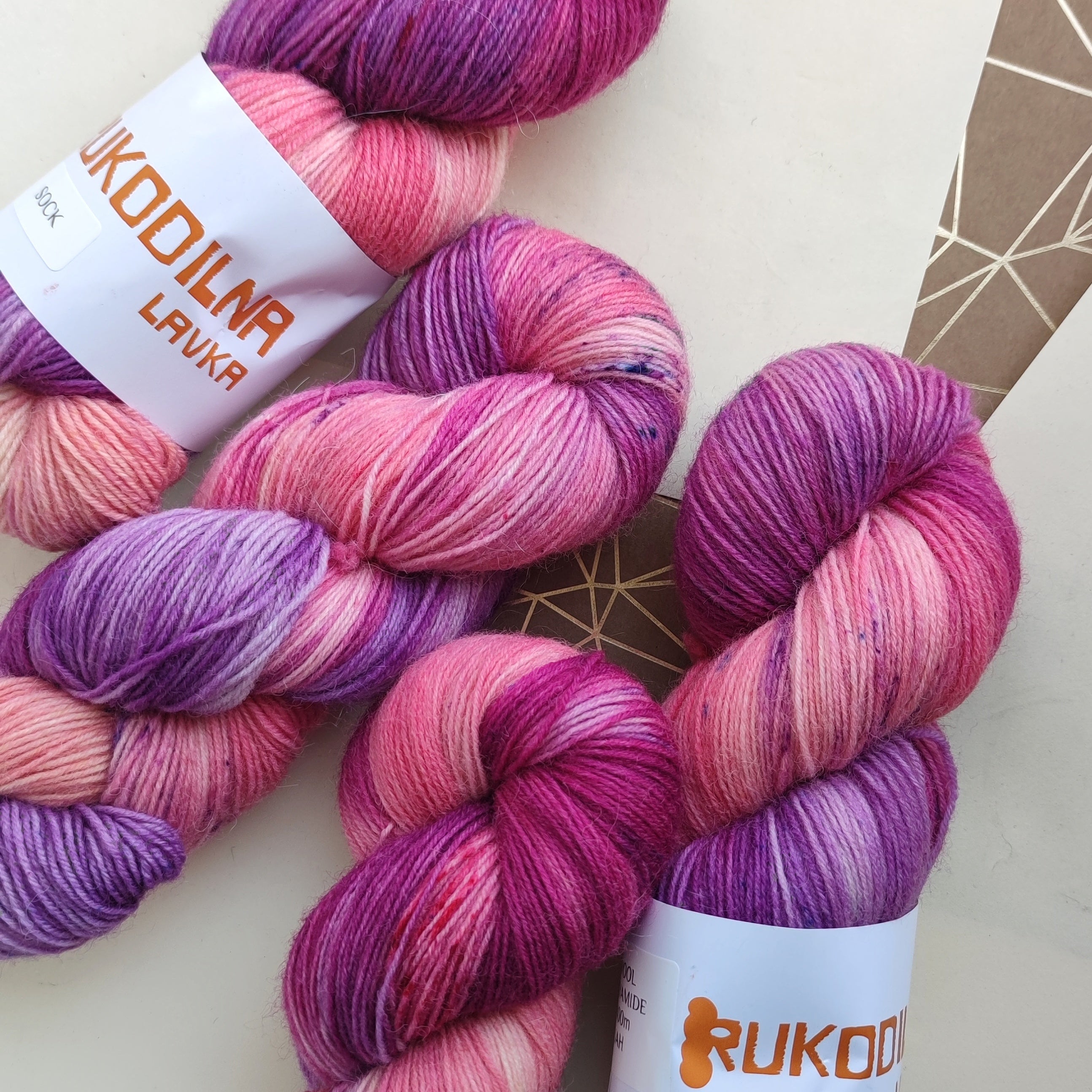 Hand dyed sock yarn in pink and purple tones, variegated fingering weight wool nylon yarn for knitting socks