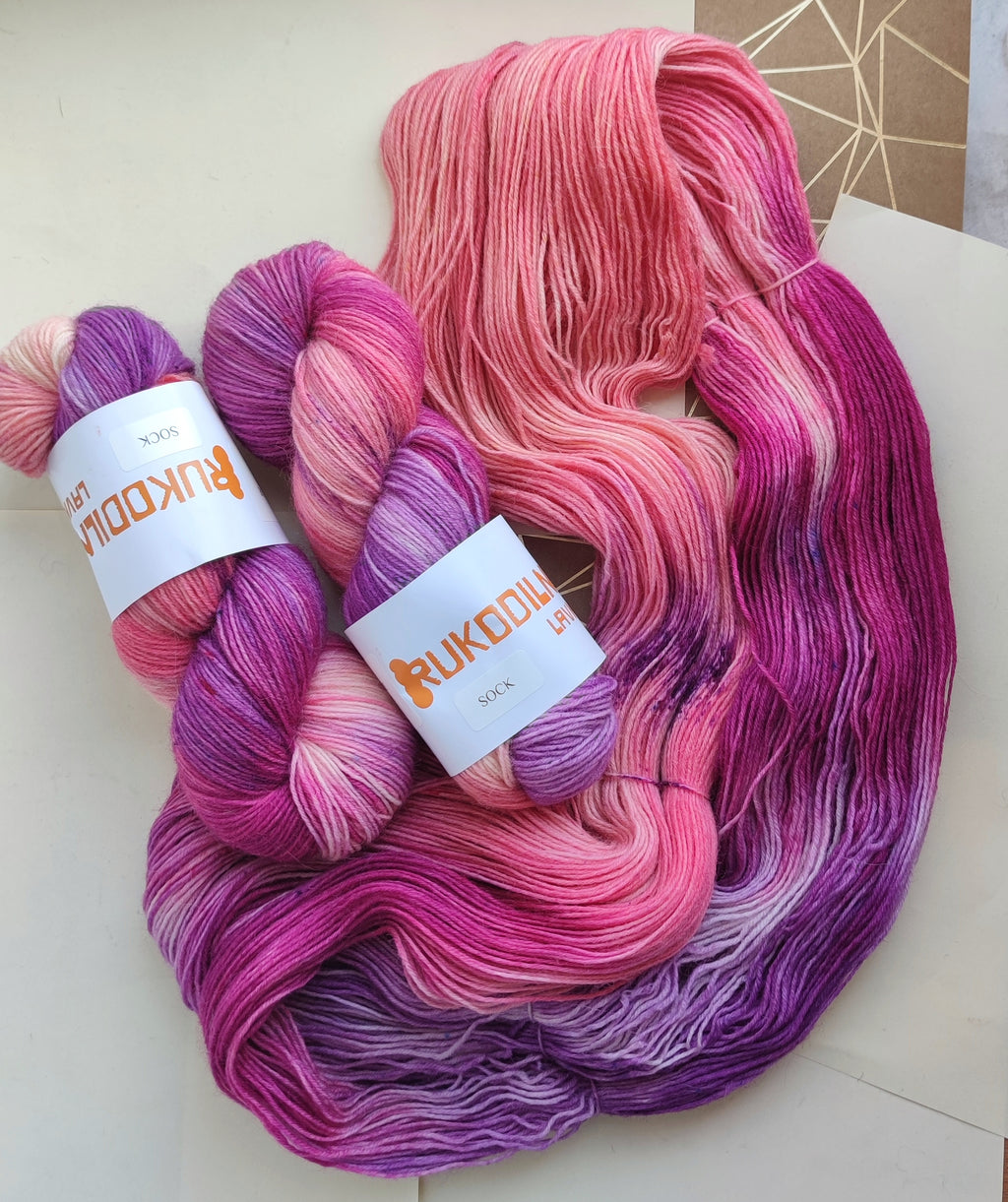 Hand dyed sock yarn in pink and purple tones, variegated fingering weight wool nylon yarn for knitting socks