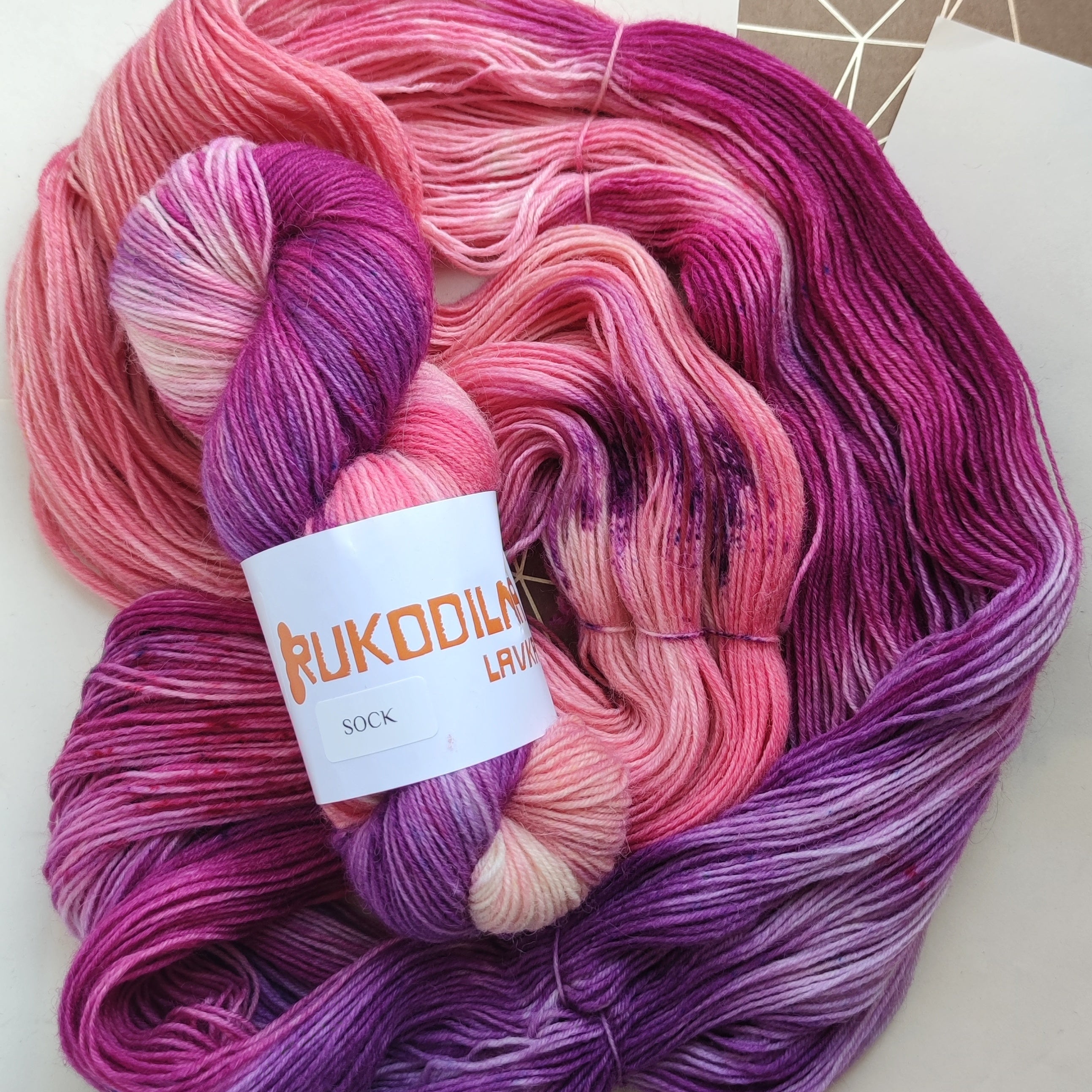 Hand dyed sock yarn in pink and purple tones, variegated fingering weight wool nylon yarn for knitting socks