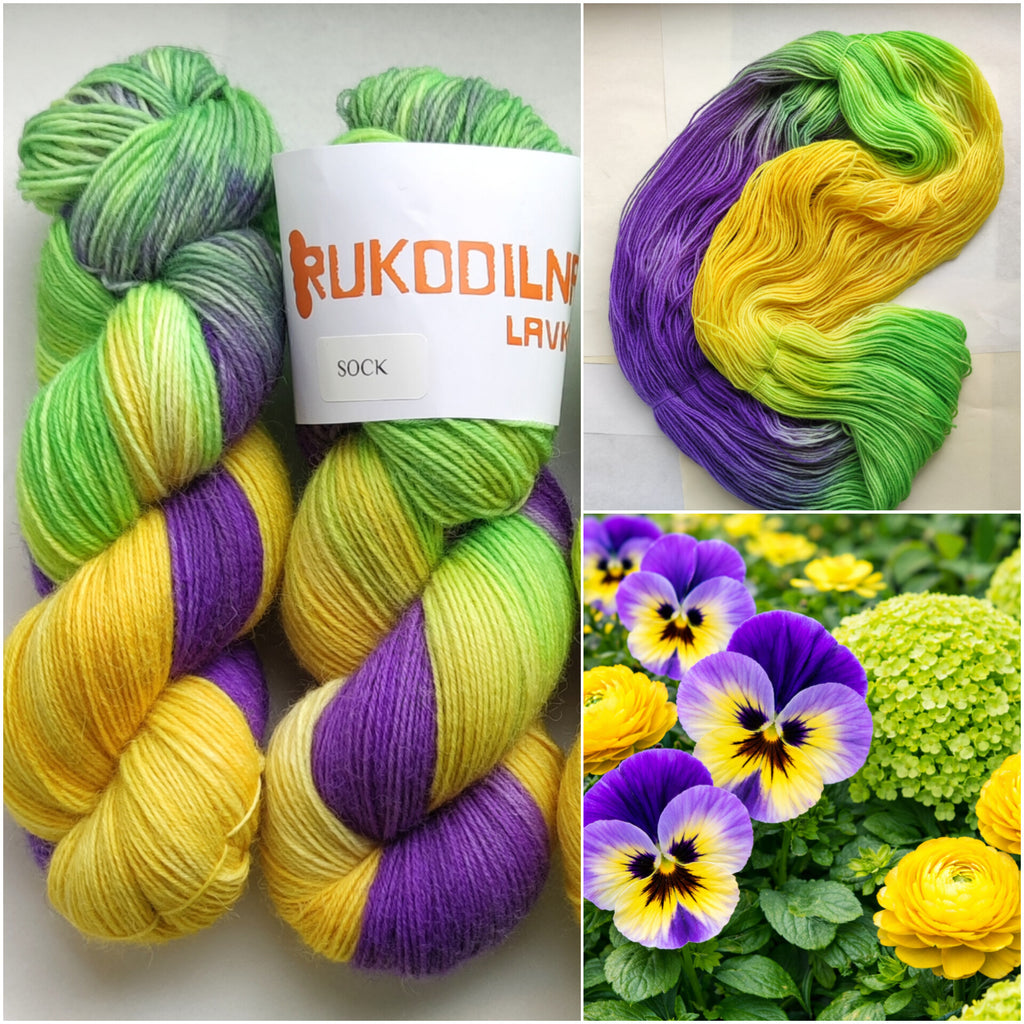Hand dyed sock yarn skeins in purple, yellow and green variegated colors inspired by spring flowers
