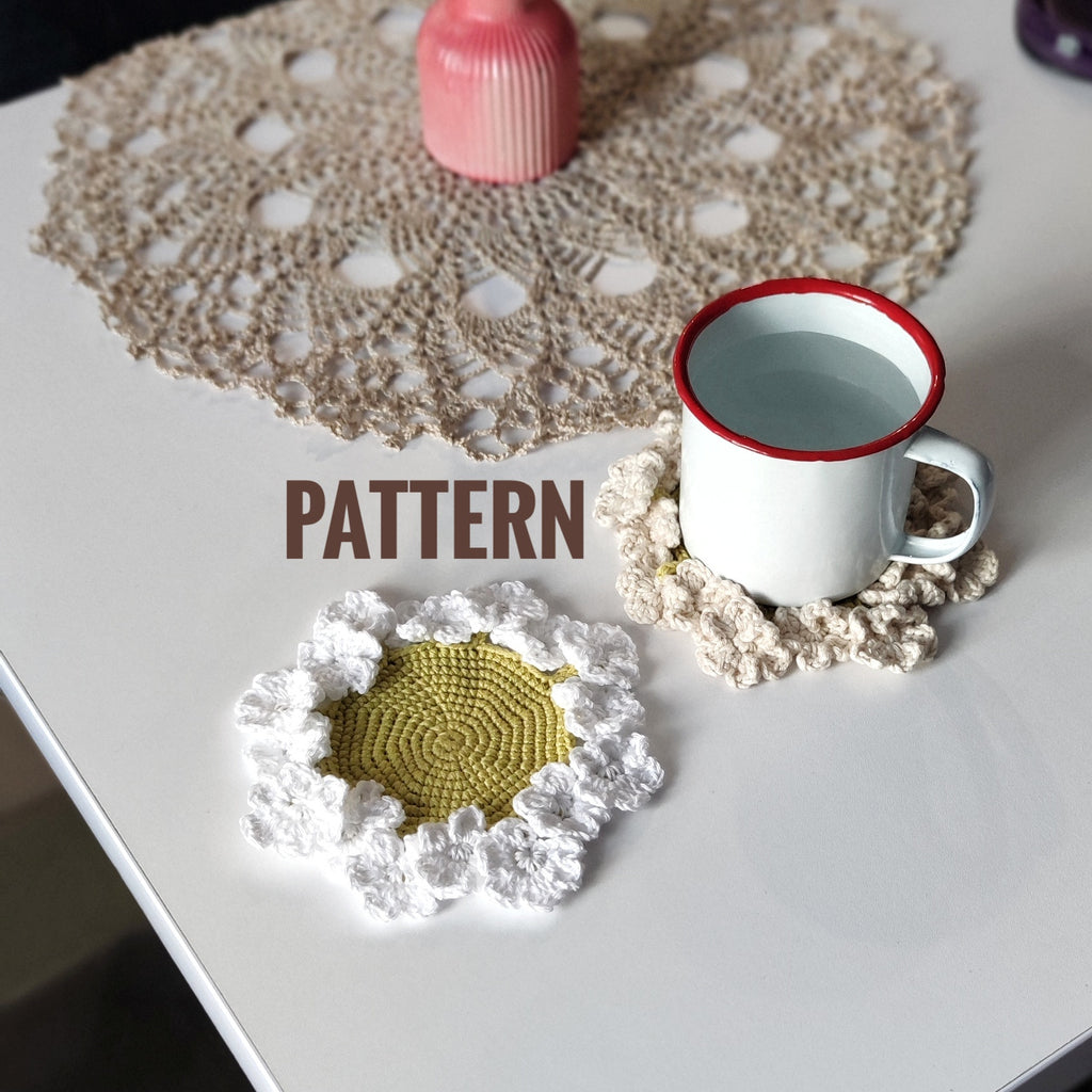Flower crochet coaster with ruffled edge under coffee mug