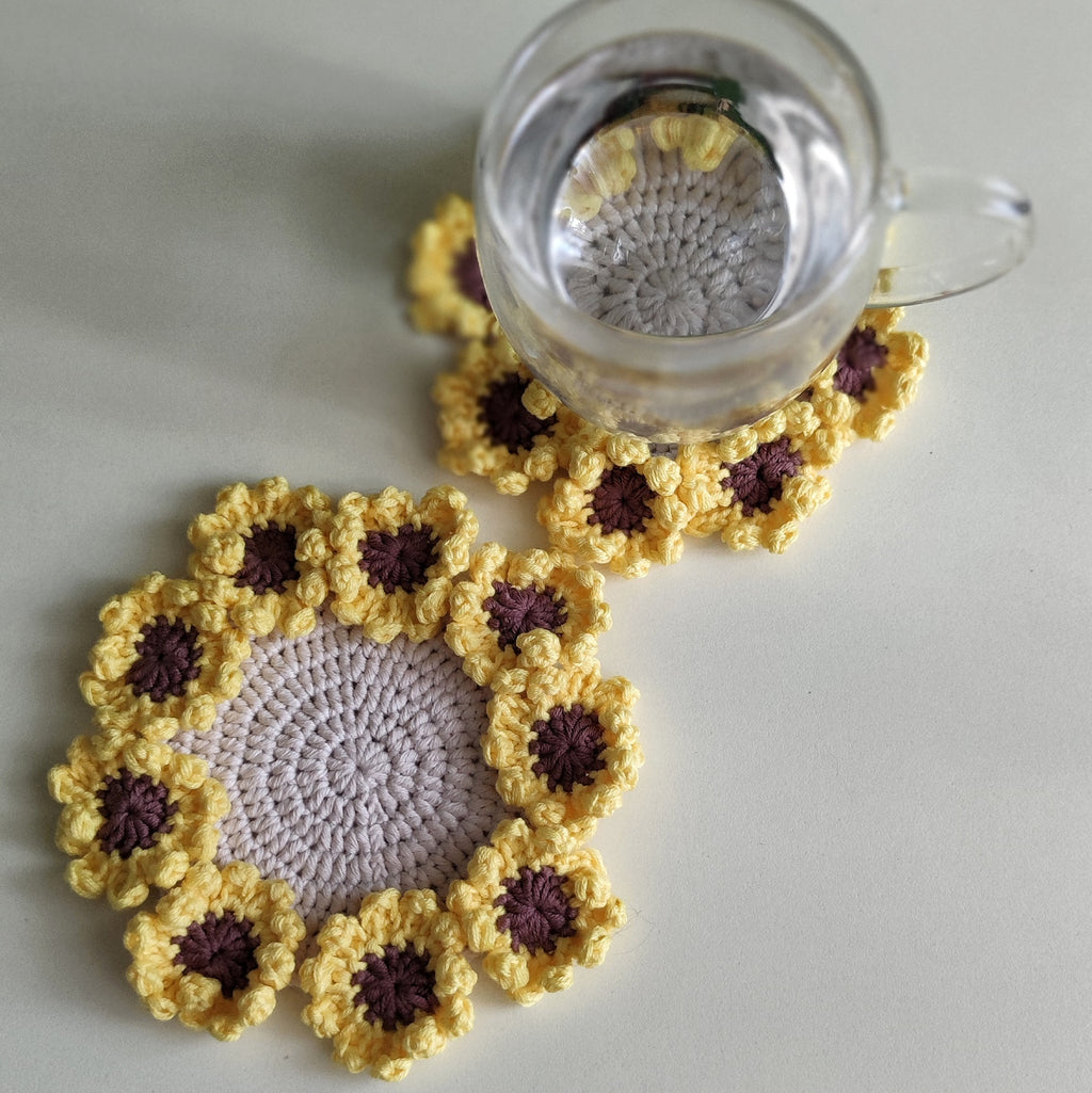 Sunflower crochet coasters with textured petal clusters, pattern example shown.