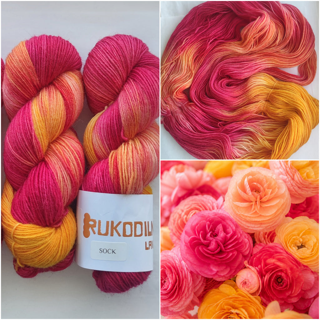 Hand dyed pink orange variegated sock yarn skeins with bright floral inspired color palette