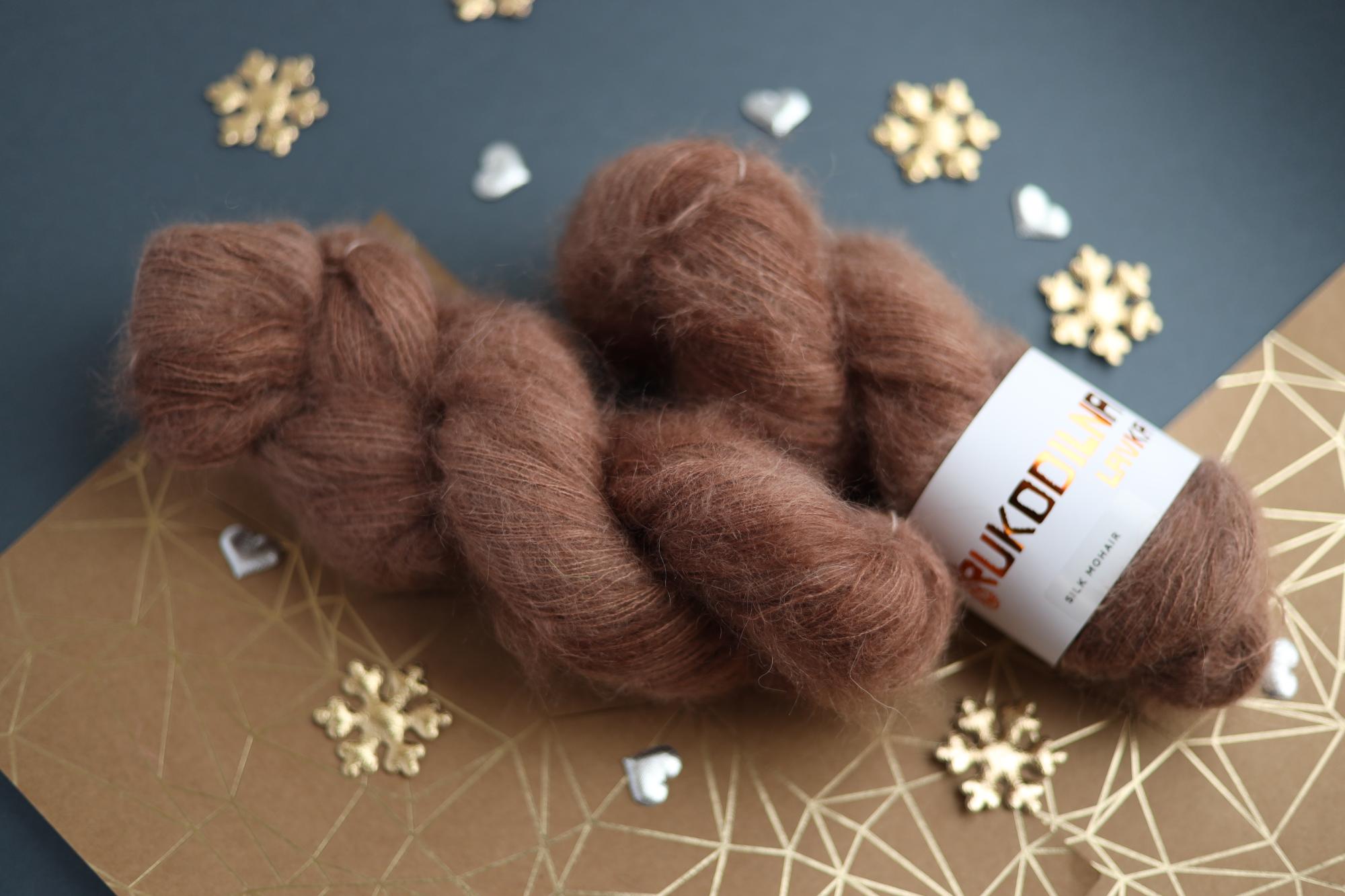 Three skeins of hand-dyed brown kid mohair silk yarn showing fluffy halo texture