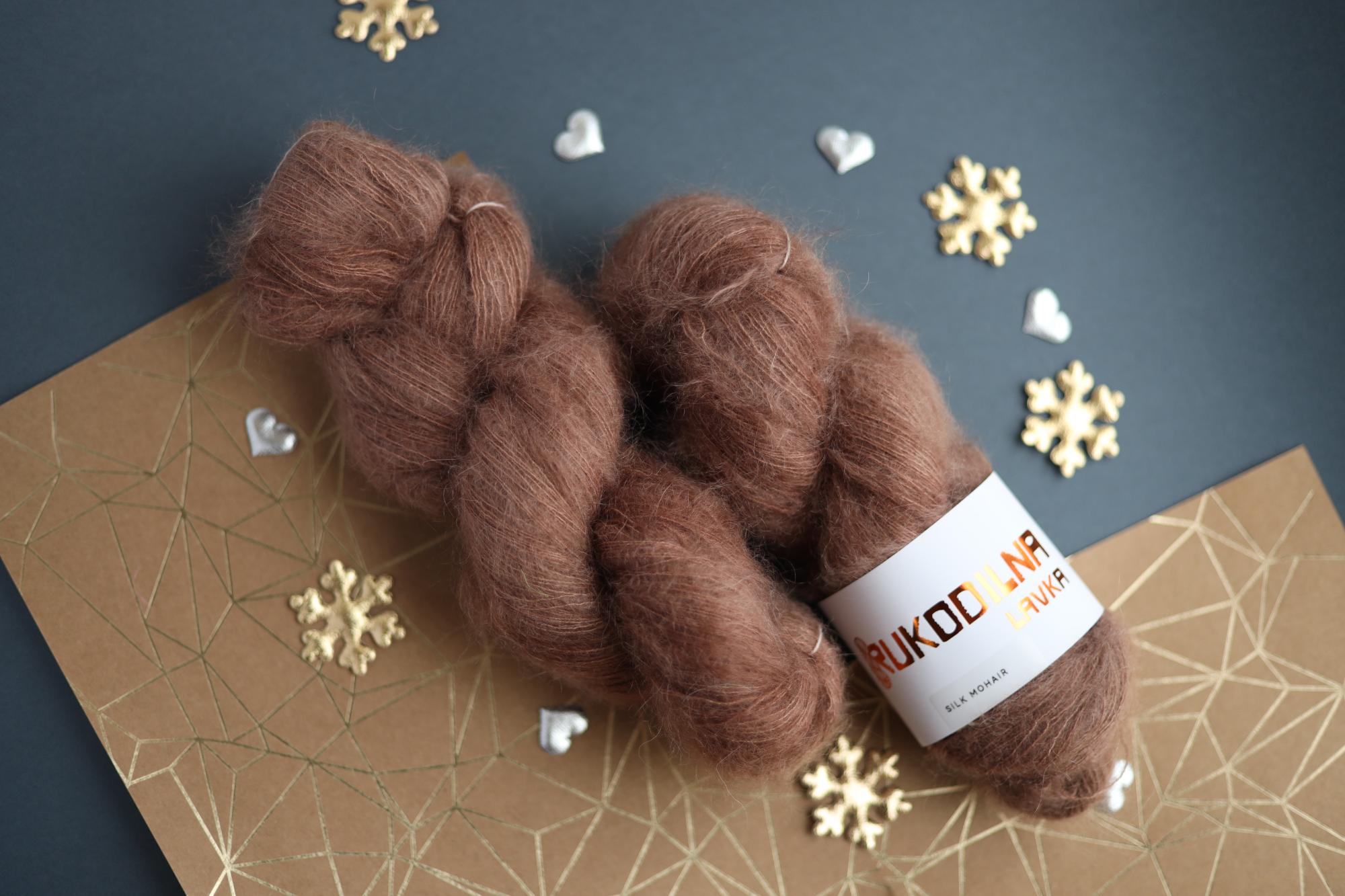 Three skeins of hand-dyed brown kid mohair silk yarn showing fluffy halo texture