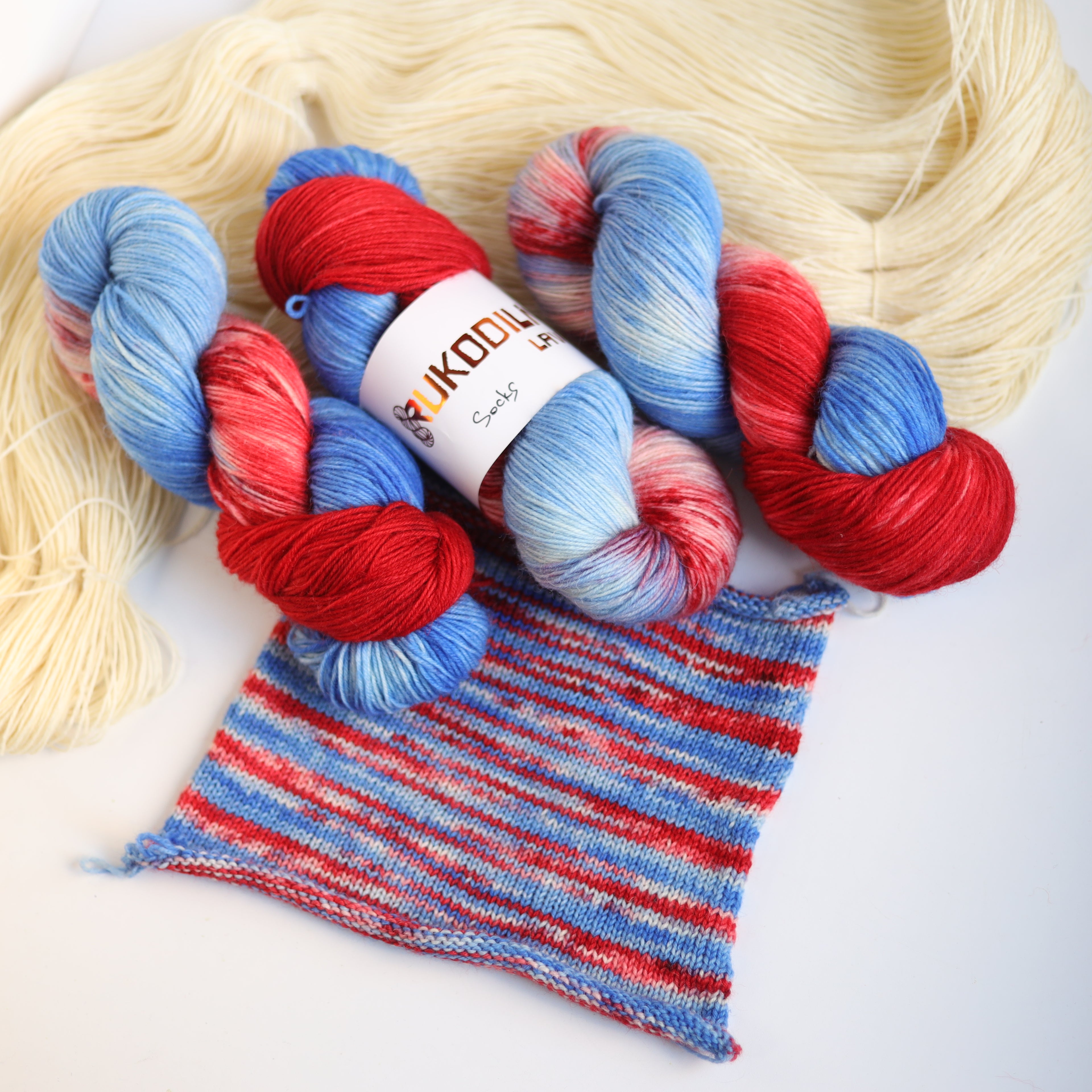 Hand dyed red and blue sock yarn made from Italian superwash wool, fingering weight 4-ply yarn dyed in Ukraine