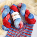 Hand dyed red and blue sock yarn made from Italian superwash wool, fingering weight 4-ply yarn dyed in Ukraine