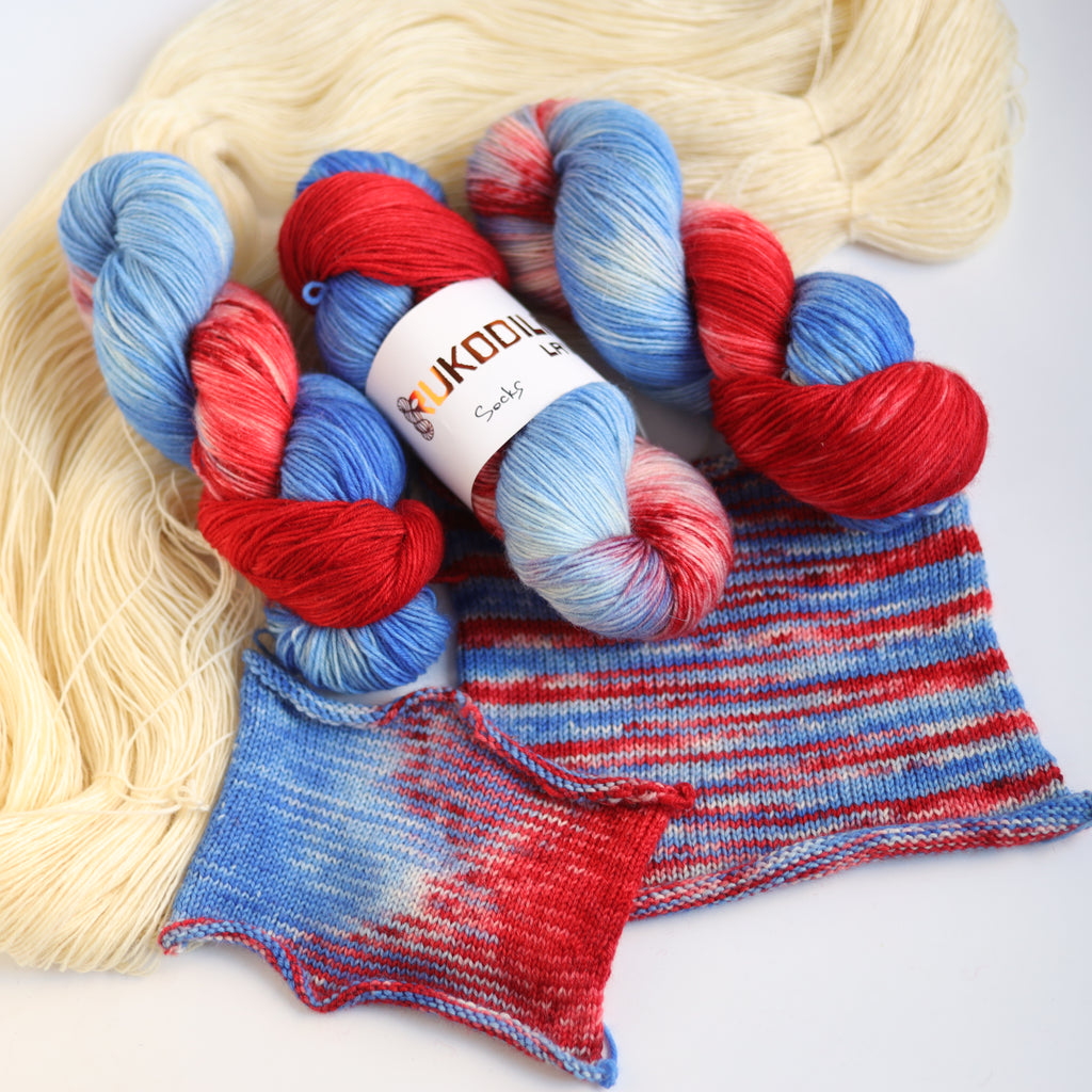 Hand dyed red and blue sock yarn made from Italian superwash wool, fingering weight 4-ply yarn dyed in Ukraine