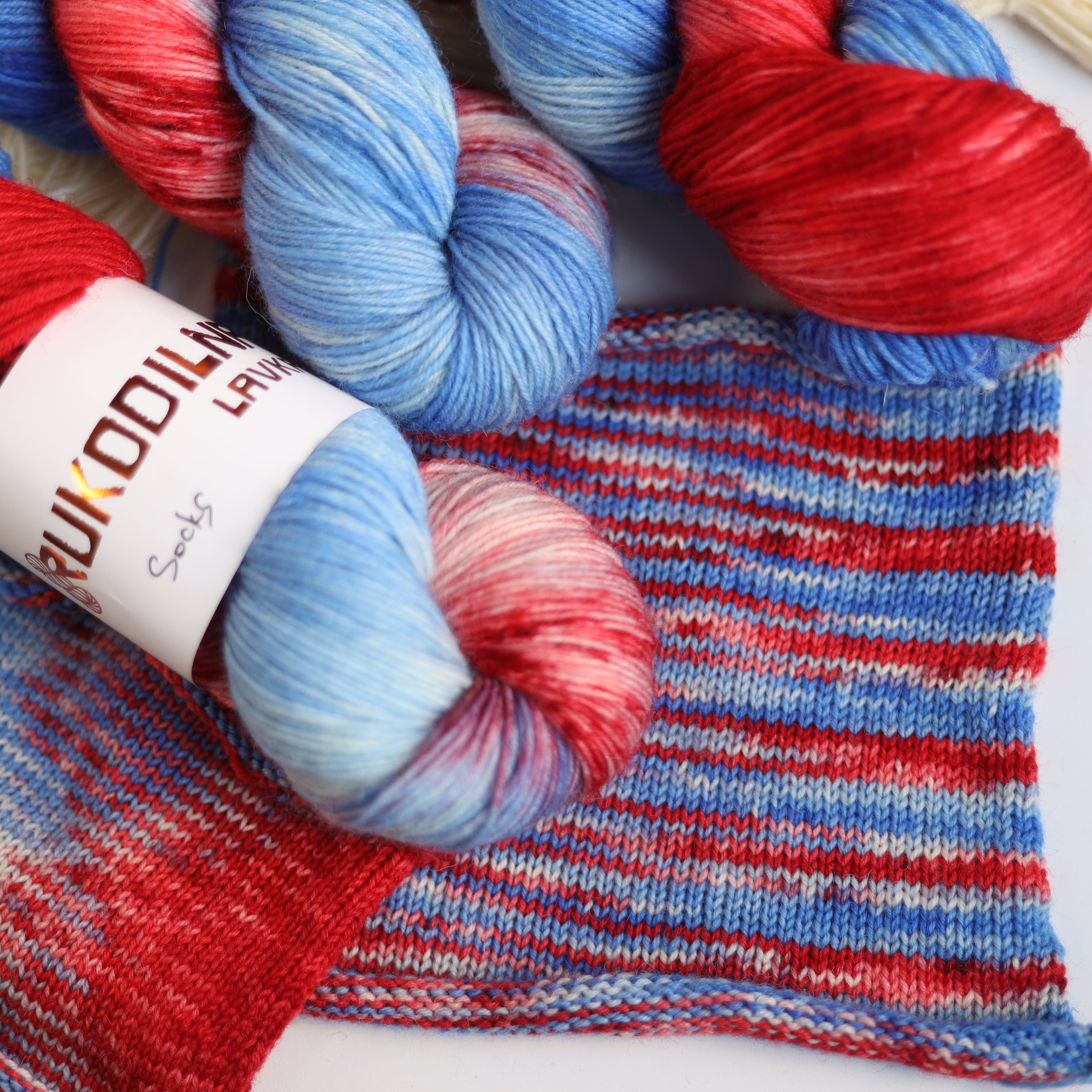Hand dyed red and blue sock yarn made from Italian superwash wool, fingering weight 4-ply yarn dyed in Ukraine