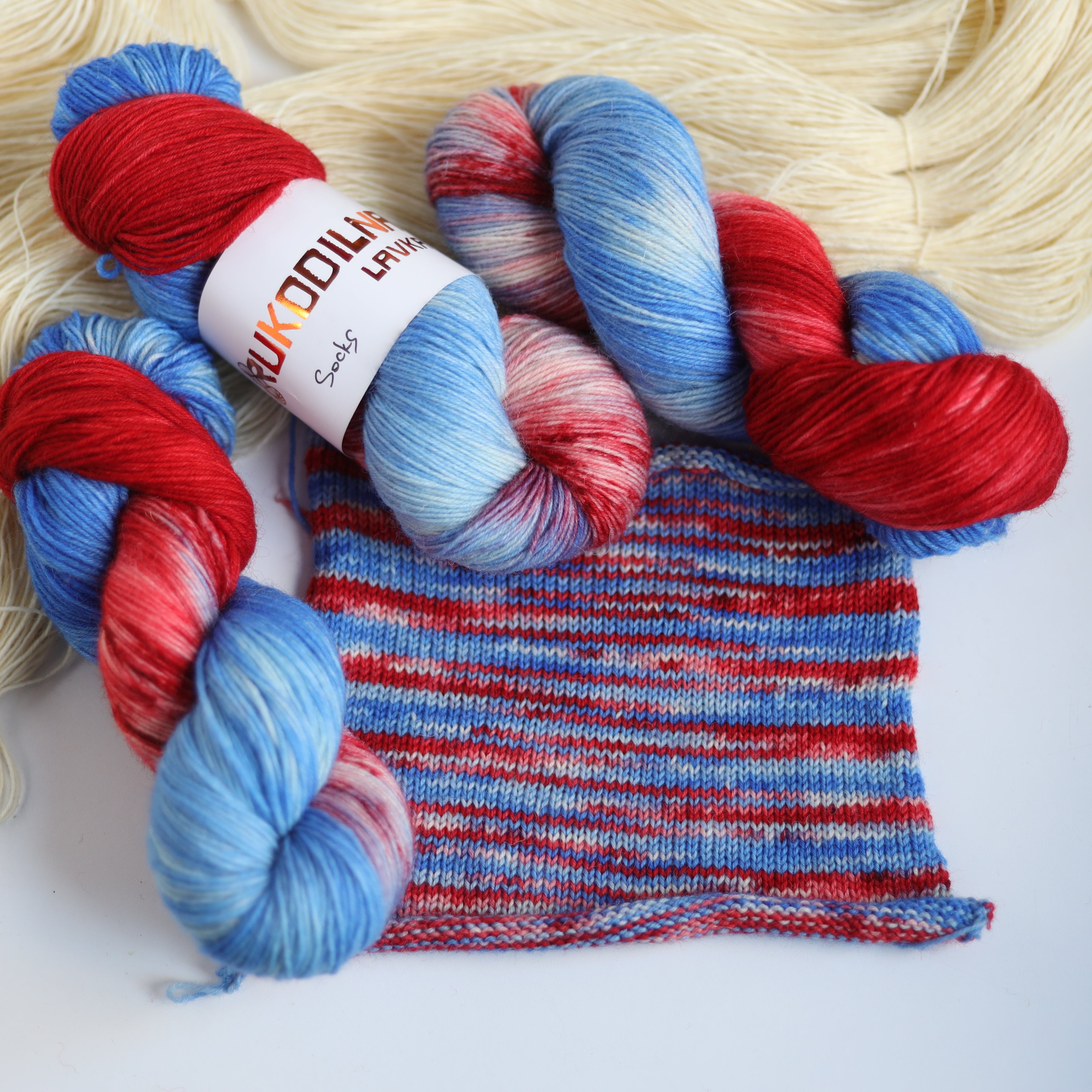 Hand dyed red and blue sock yarn made from Italian superwash wool, fingering weight 4-ply yarn dyed in Ukraine