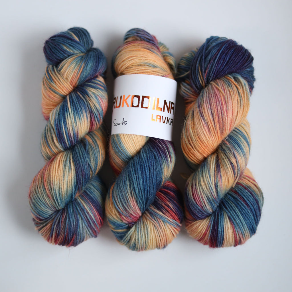 Hand dyed variegated sock yarn skeins in fingering weight wool