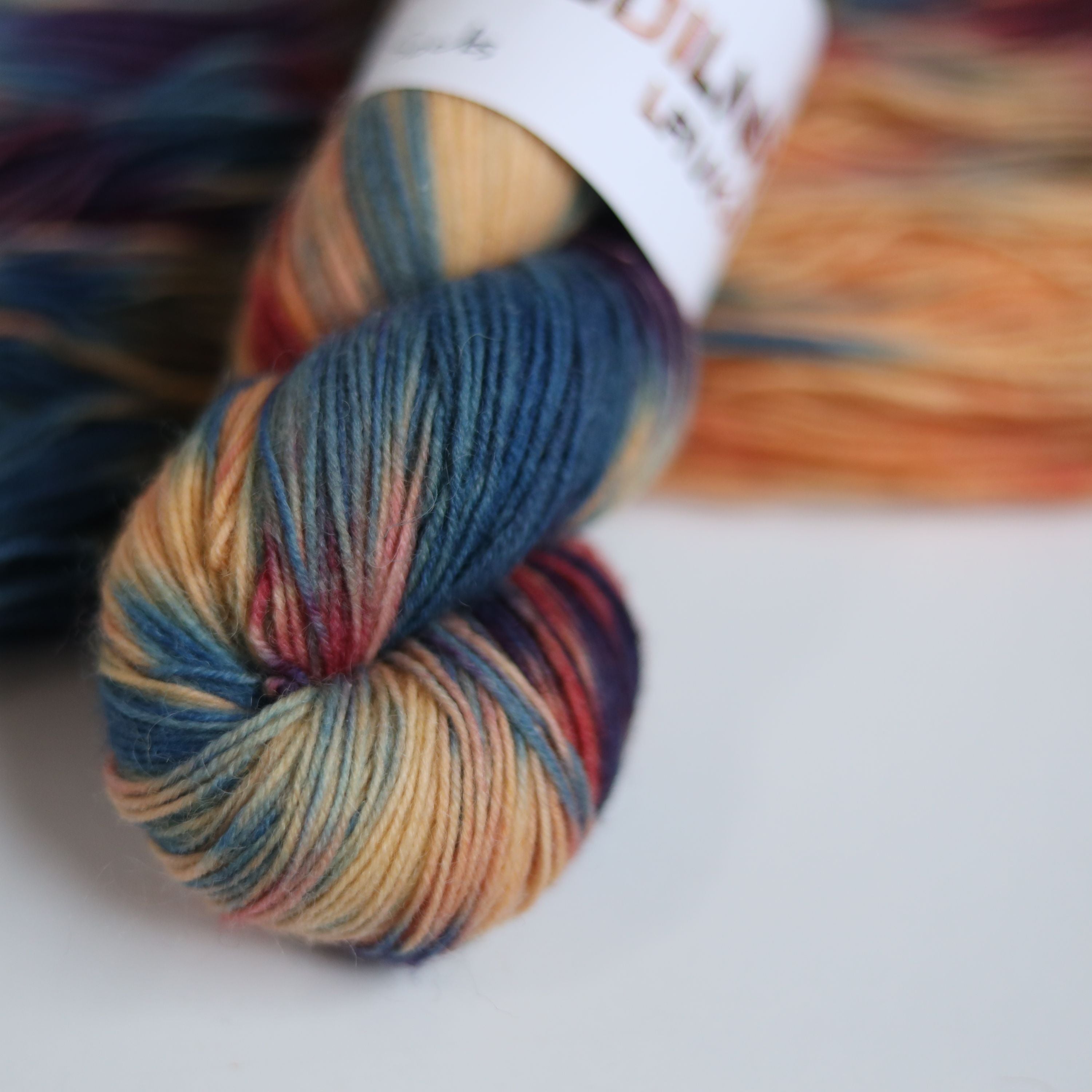 Hand dyed variegated sock yarn skeins in fingering weight wool