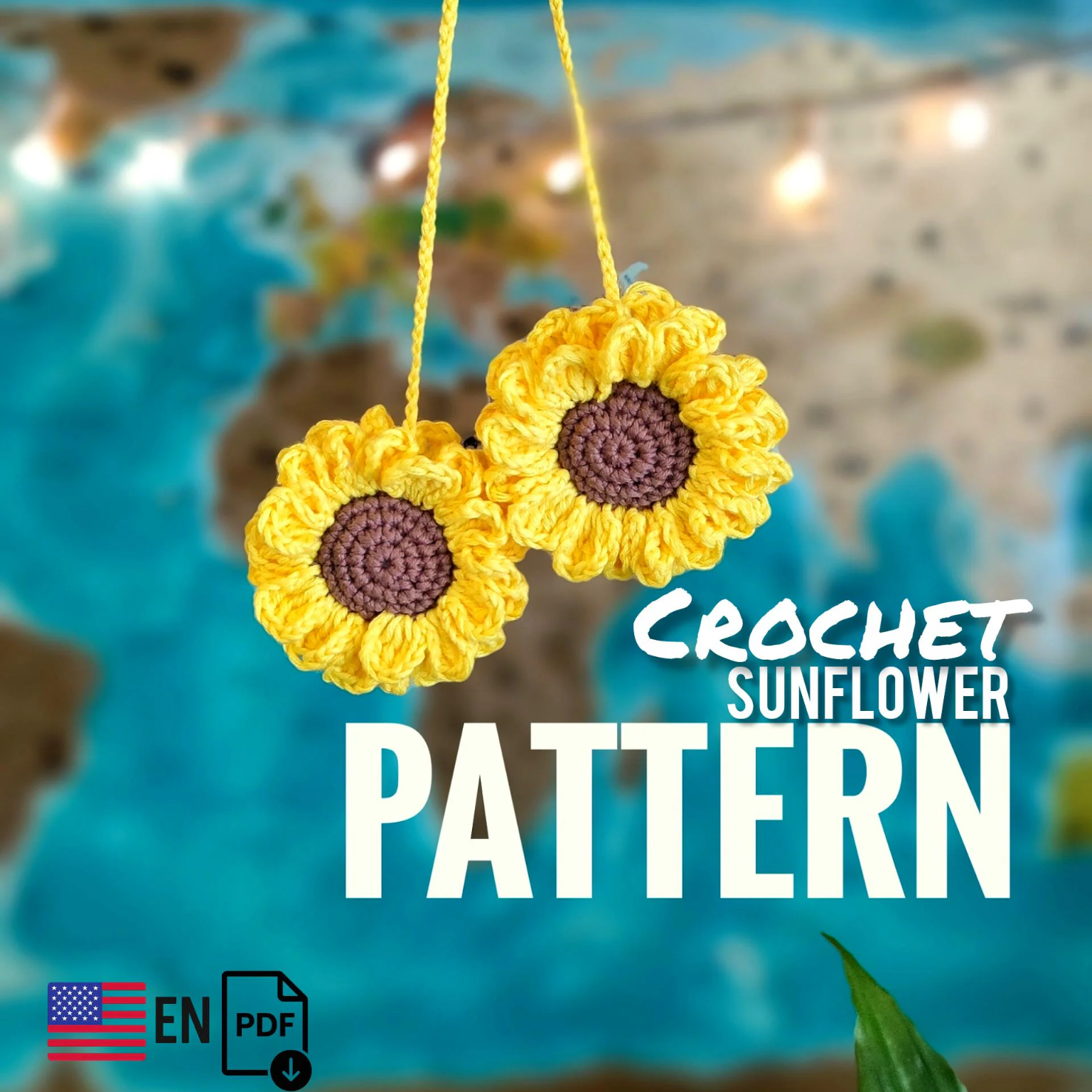 Crochet sunflower car accessory hanging on a cord, bright yellow flower with brown center used as car interior decor.