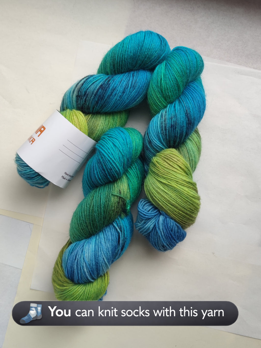 Hand dyed sock yarn in blue green tropical tones, variegated fingering weight wool nylon yarn for knitting socks