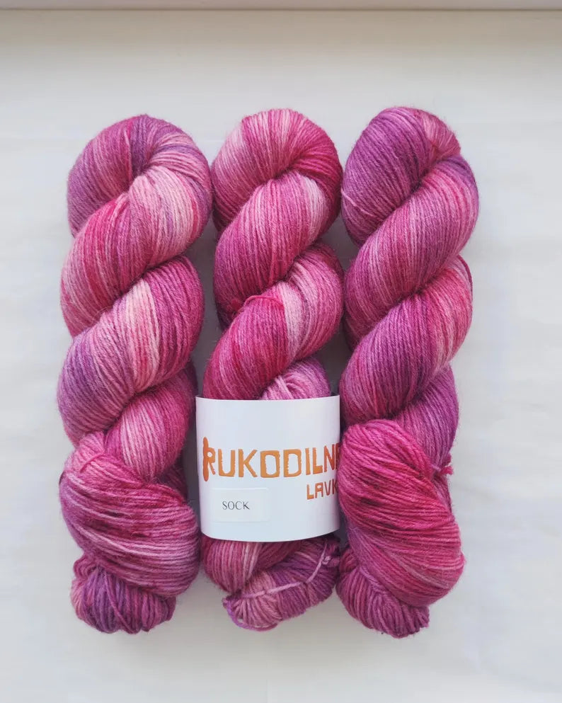 Hand dyed berry pink sock yarn with raspberry and magenta tones, wool polyamide fingering weight 4ply yarn for socks and shawls
