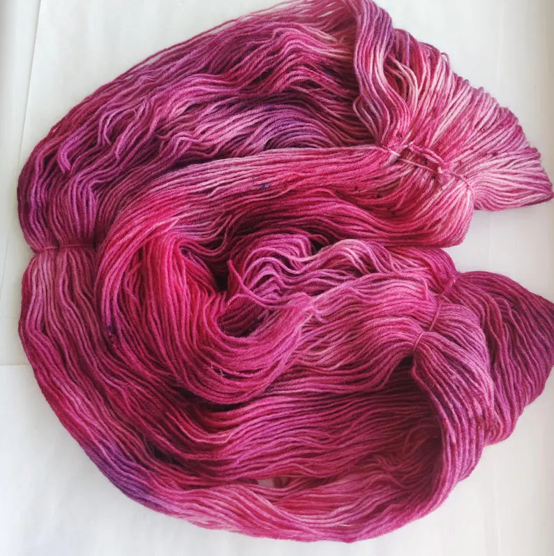 Hand dyed berry pink sock yarn with raspberry and magenta tones, wool polyamide fingering weight 4ply yarn for socks and shawls