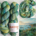Hand dyed variegated wool nylon sock yarn in green, aqua blue and pale yellow shades, fingering weight knitting yarn for socks and shawls.