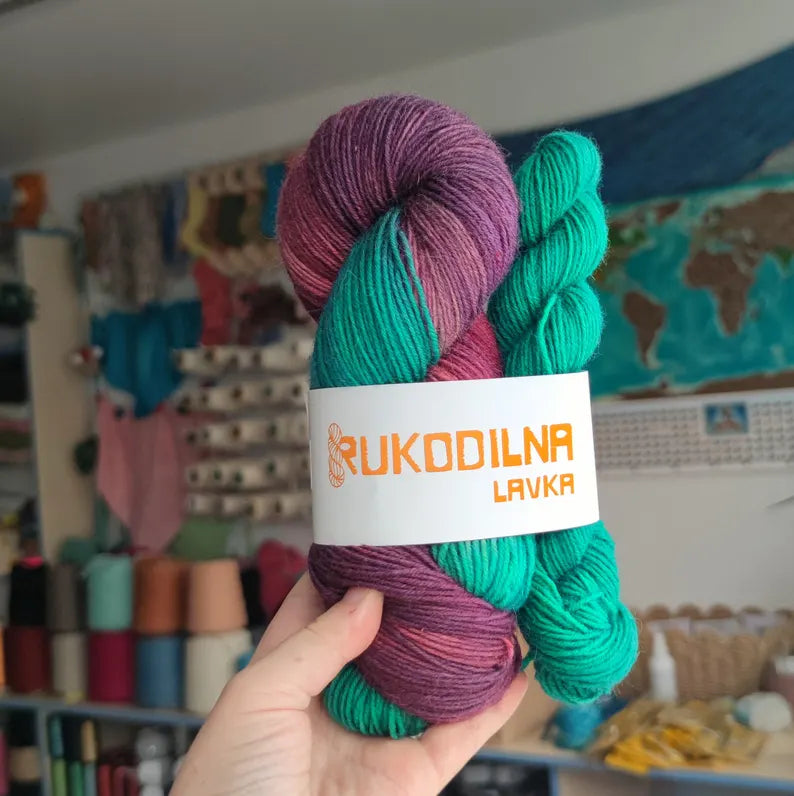 Hand dyed sock yarn set with a dark purple variegated skein and emerald green mini skein for contrast heels, toes and colorful sock knitting projects.