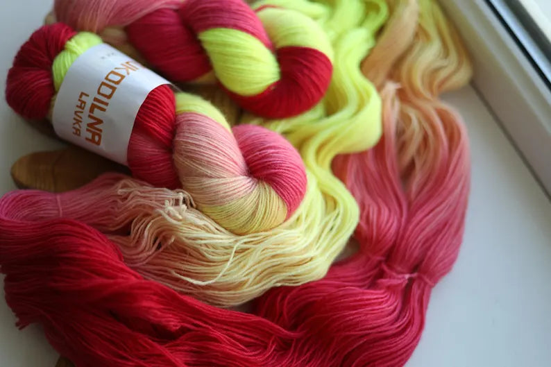Hand-dyed fingering weight sock yarn in pink, coral, neon yellow and blush shades, 100g 400m, 75% wool and 25% polyamide.