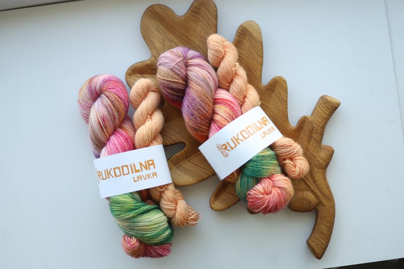 Hand-dyed variegated sock yarn set with one 100g skein and one matching mini skein in peach, blush pink, sage green and lavender colors.