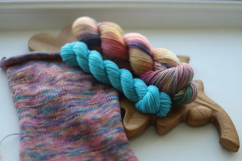 Hand dyed rainbow variegated sock yarn set with one 100g skein and one turquoise 20g mini skein