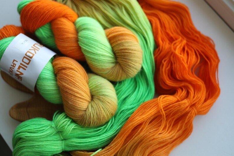 Hand dyed neon sock yarn in orange lime green and yellow, fingering weight wool nylon knitting yarn