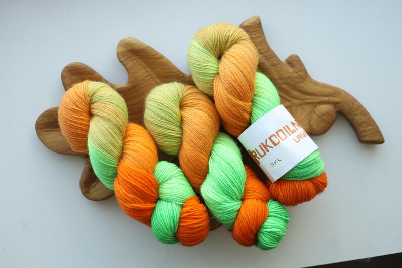 Hand dyed neon sock yarn in orange lime green and yellow, fingering weight wool nylon knitting yarn
