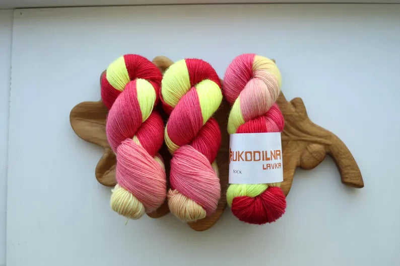 Hand-dyed fingering weight sock yarn in pink, coral, neon yellow and blush shades, 100g 400m, 75% wool and 25% polyamide.