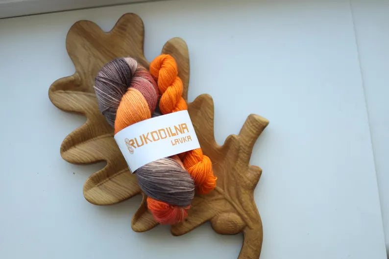 Hand dyed fall sock yarn set with a variegated taupe and rust skein paired with a bright pumpkin orange mini skein for knitting socks.