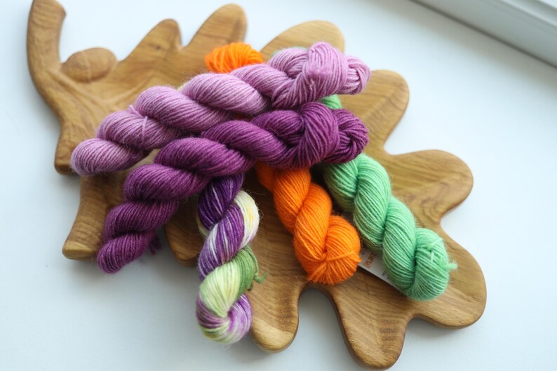 Bright hand dyed mini skein set in purple lavender orange green and multicolor fingering weight sock yarn