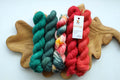 Christmas mini skein set with five hand dyed red green and multicolor fingering weight sock yarn minis