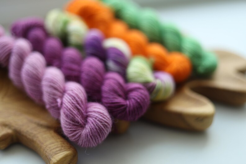 Bright hand dyed mini skein set in purple lavender orange green and multicolor fingering weight sock yarn