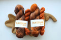 Hand dyed brown orange sock yarn set with 100 g variegated skein and 20 g orange mini skein.