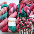 Pink and green hand dyed sock yarn, colorful 4-ply fingering yarn for knitting socks.