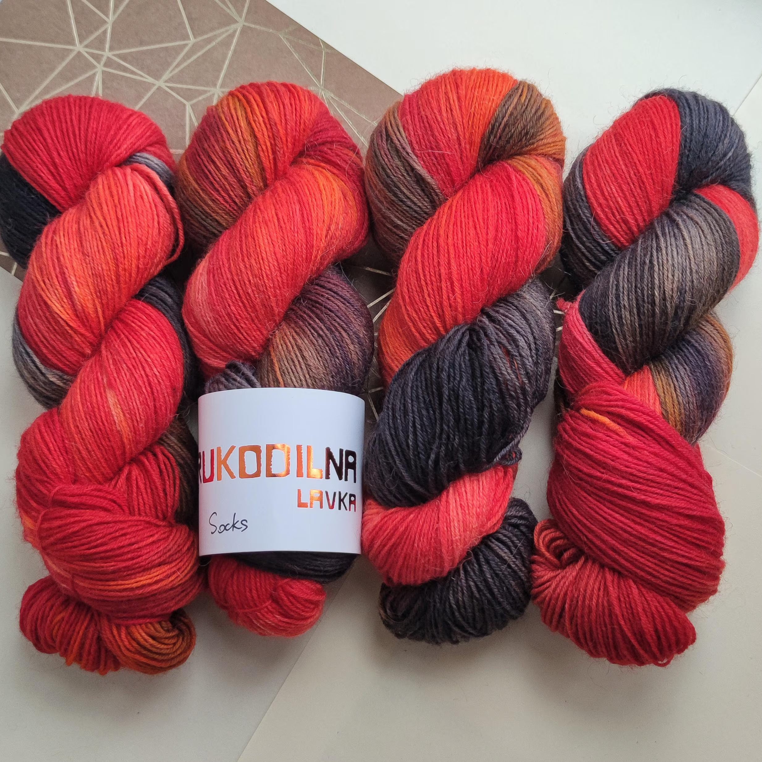 Hand dyed red black sock yarn with fiery orange transitions, goth inspired wool polyamide fingering weight 4ply yarn for socks and shawls