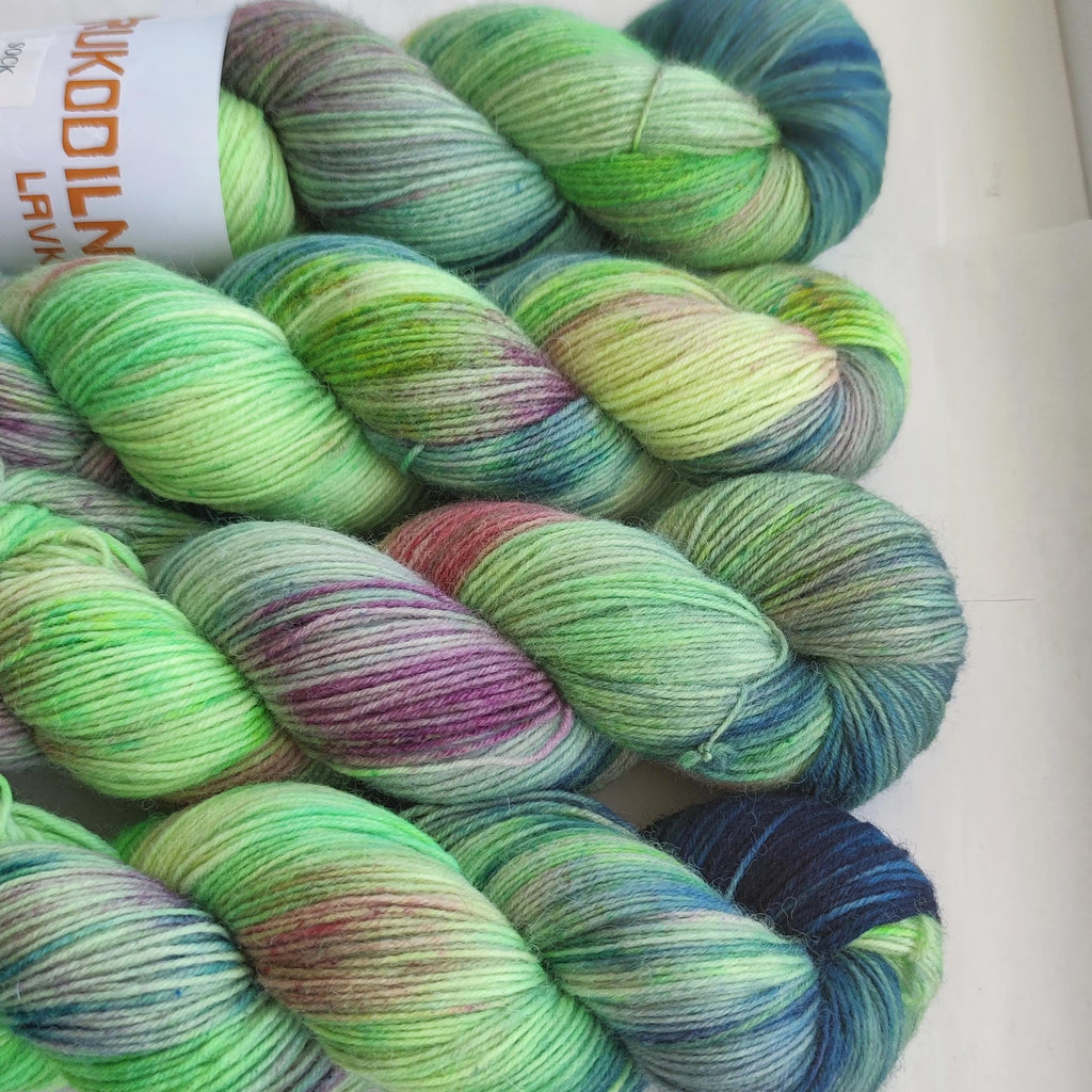 Hand dyed sock yarn set with mint green main skein and coordinating neon green and lilac mini skeins for knitting and crochet projects.