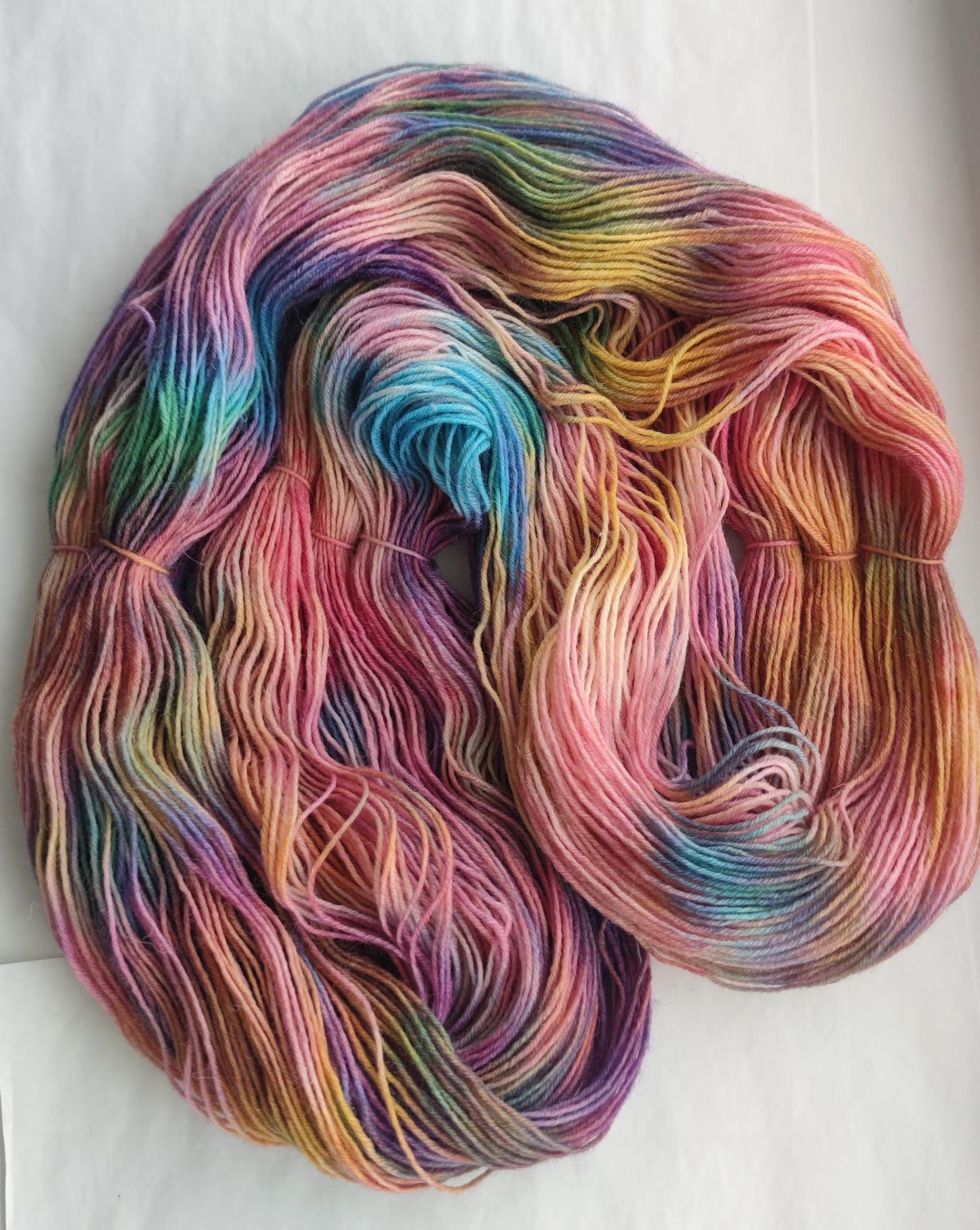 Hand dyed variegated sock yarn in layered jewel tones, wool polyamide fingering weight 4ply yarn for knitting socks, shawls and sweaters